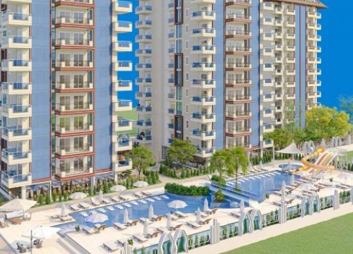 Новая квартира 1+1 в строящемся комплексе в районе Махмутлар
