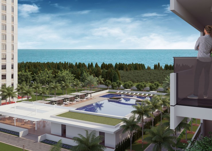 Жилой комплекс с красивой территорией и большими квартирами недалеко от моря в Мерсине