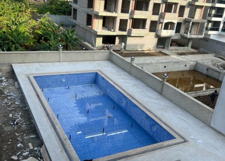 Новая двухкомнатная квартира в современном комплексе в районе Махмутлар